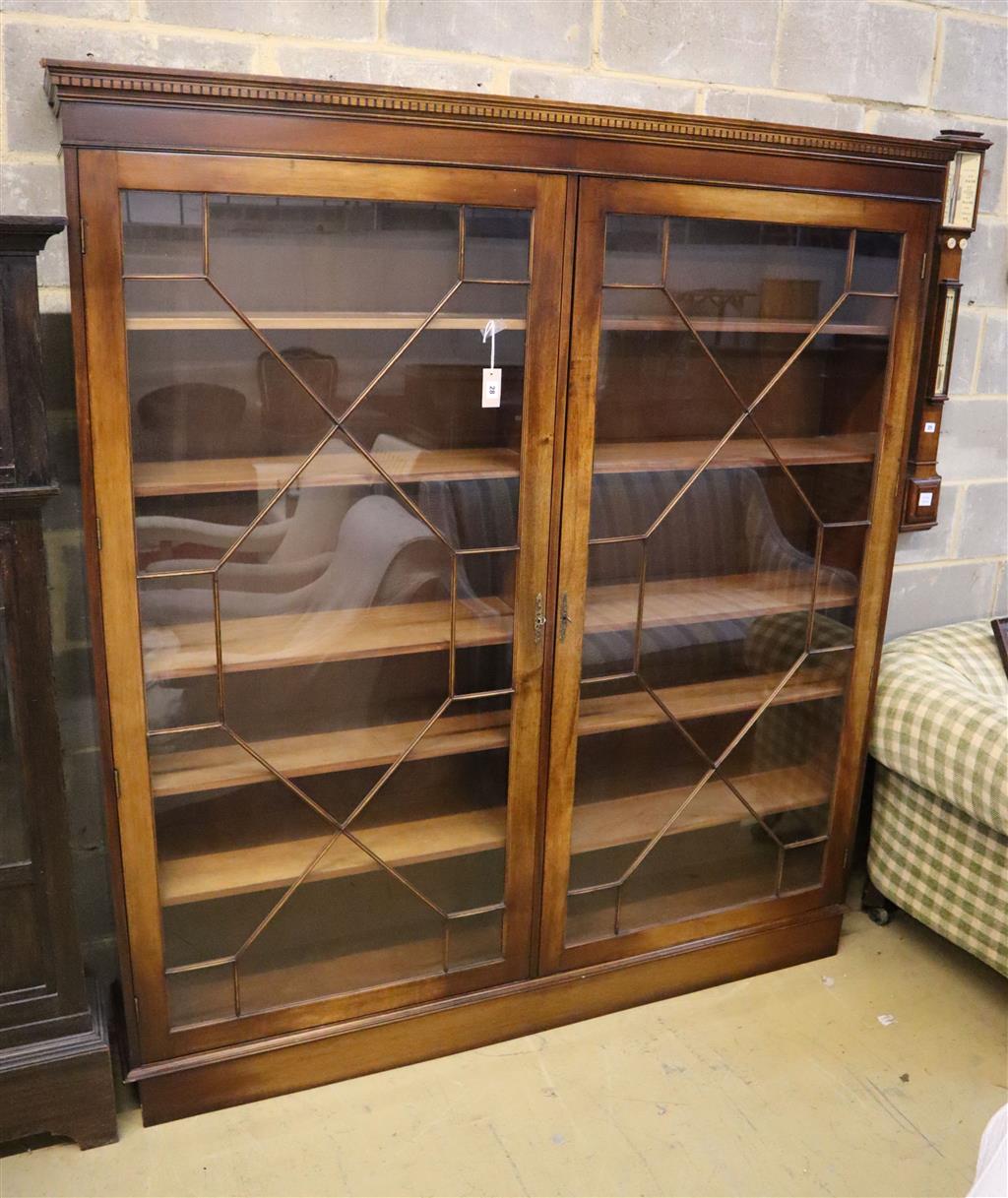 A Georgian style mahogany bookcase fitted a pair of astragal-glazed doors on plinth base, width 178cm, depth 32cm, height 196cm